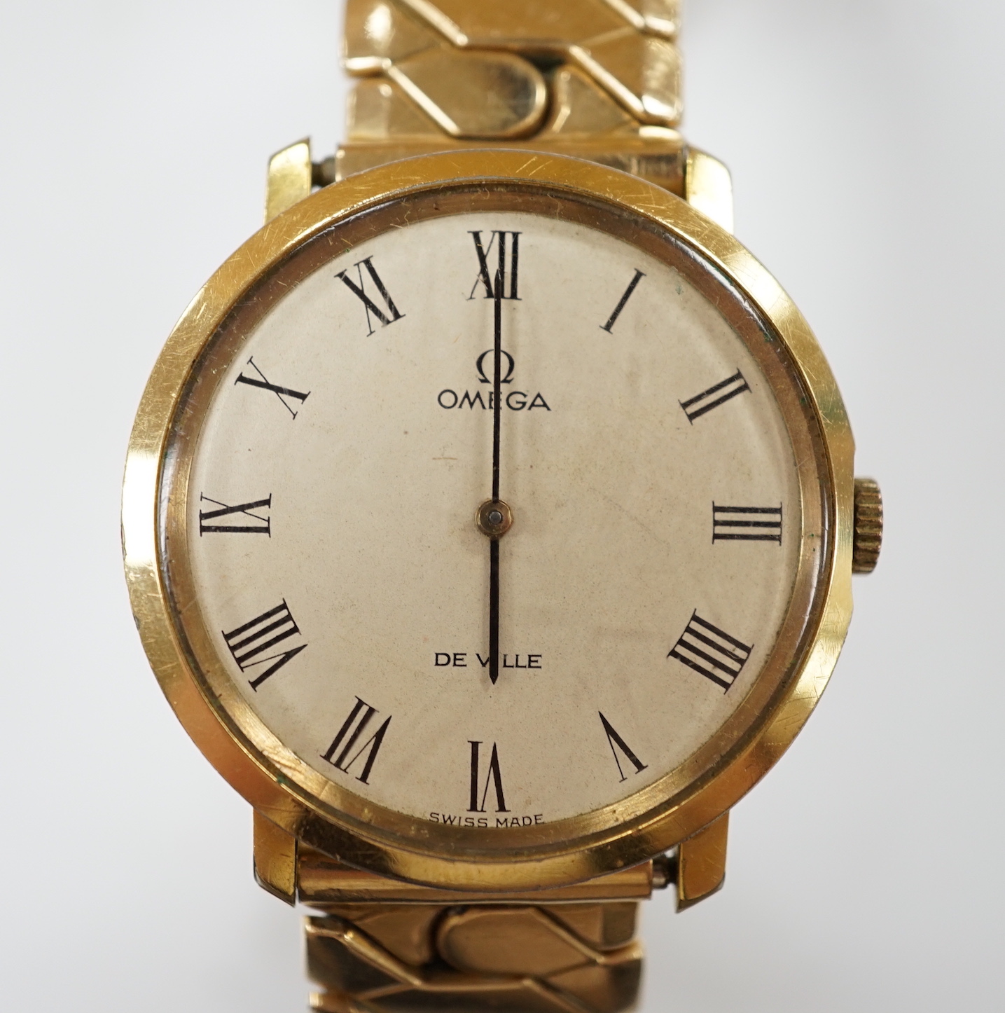 A gentleman's steel and gold plated Omega De Ville manual wind wrist watch, on associated flexible strap, case diameter 33mm, no box or papers.